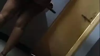 Hot figure standing topless in front of mirror