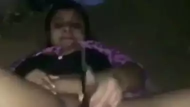 Nude desi lady fucks her hairy pussy with a brinjal