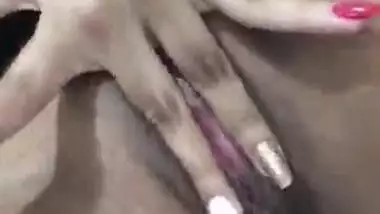 Indian porn video of an amateur girlfriend finger fucking her pussy on cam