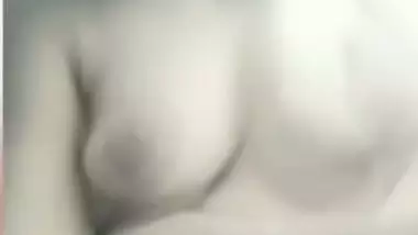 Chubby shy Indian girl showing round boobs to lover