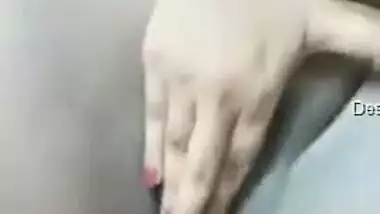 Naked Desi bombshell gently massages her XXX vagina in the bedroom
