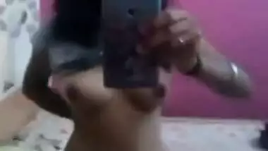 Pretty Desi gal stays naked in front of mirror and films her XXX body