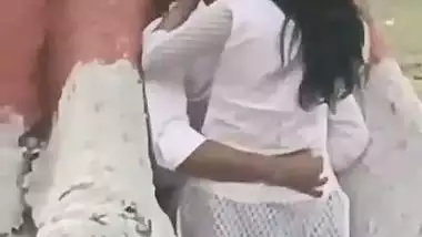 College couple enjoys outdoor sex below a big tree